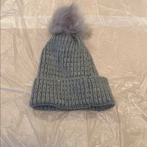 Hat with crystals and puff ball